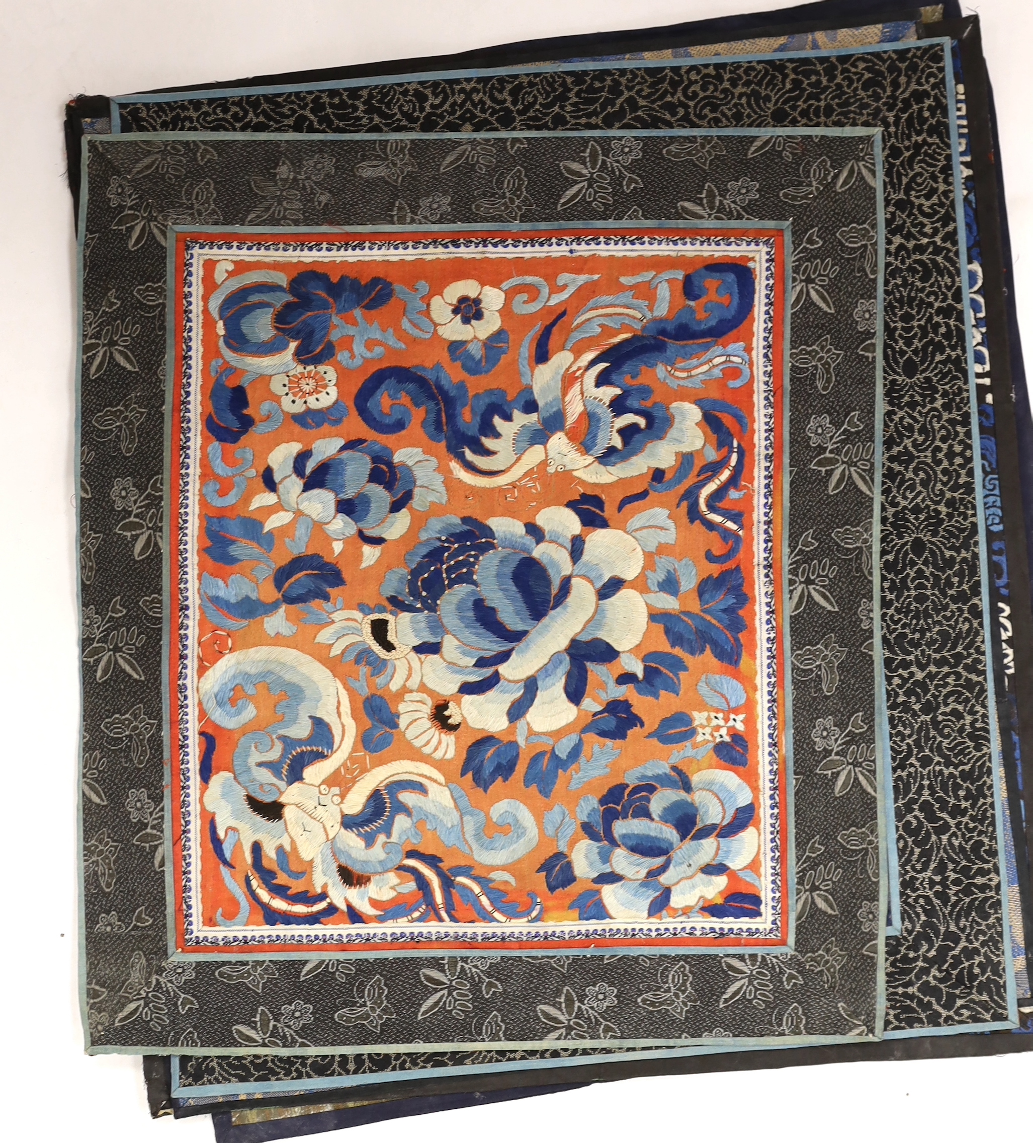 Nine Chinese silk embroidered panels, framed with silk damask borders, circa 20th century, largest 37cm x 41cm